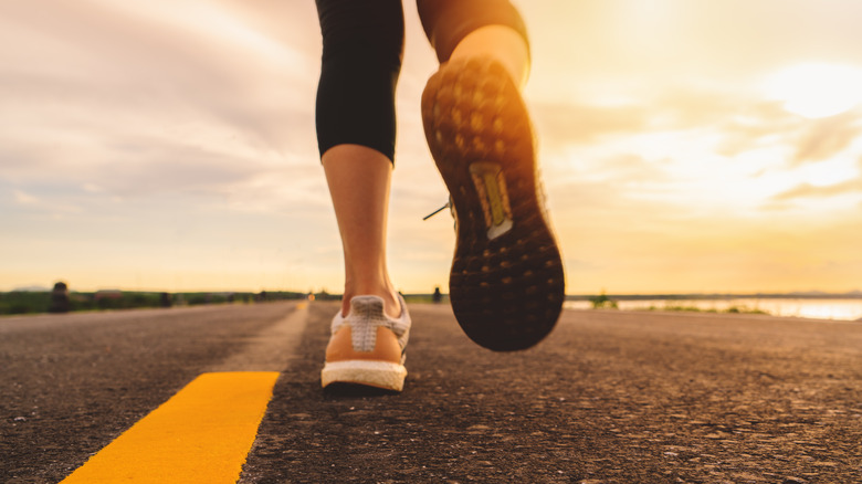 feet running asphalt