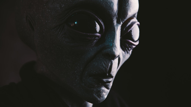alien face black background