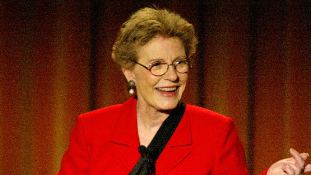 Patty Duke on stage in red
