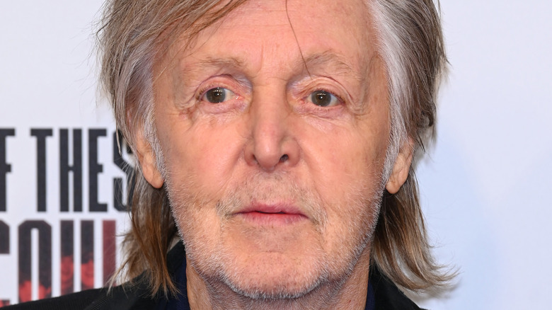 Older Paul McCartney looking off to the side