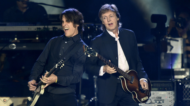 Rusty Anderson performing in concert with Paul McCartney