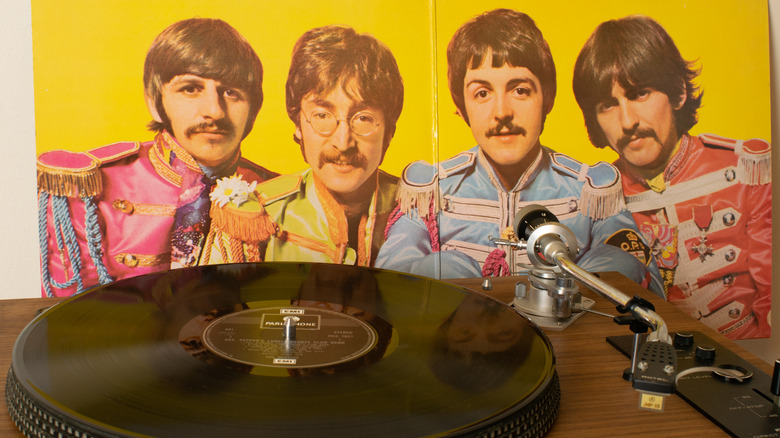 Beatles album art and record on a player
