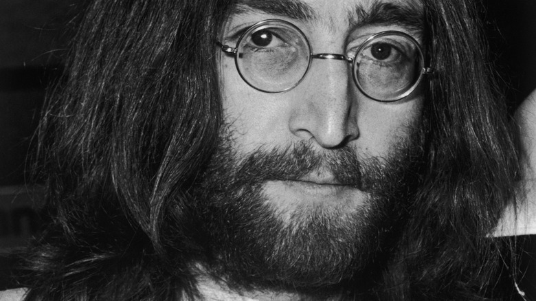 Close up of John Lennon with long hair