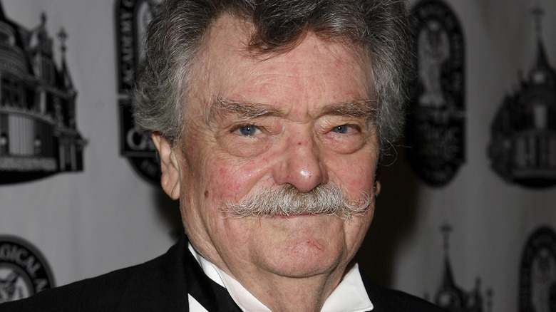 Bernard Fox tuxedo moustache smiling