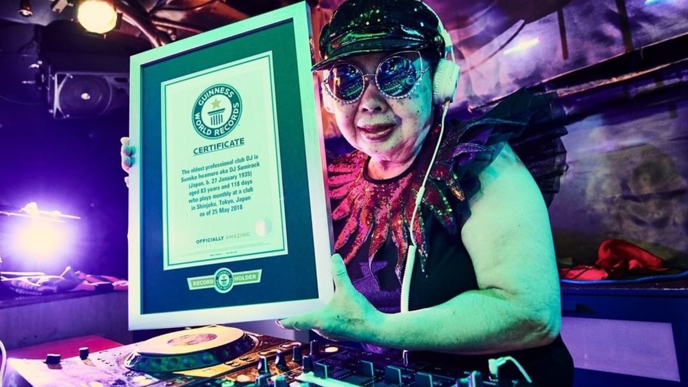 DJ Sumirock holding plaque