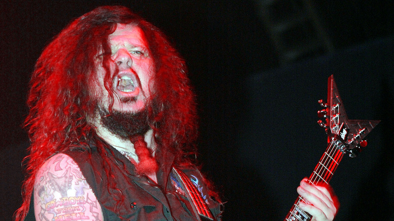 dimebag darrell red lit playing guitar