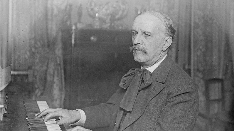 Louis Vierne suit moustache playing organ
