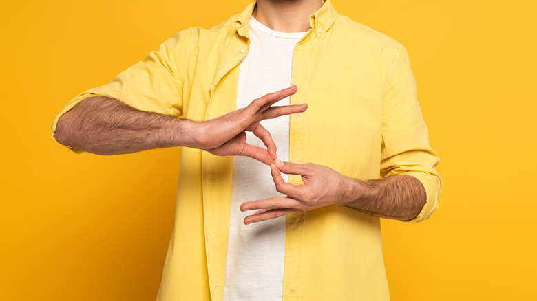 Male hands signing 