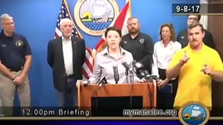 amateur interpreter at news briefing 