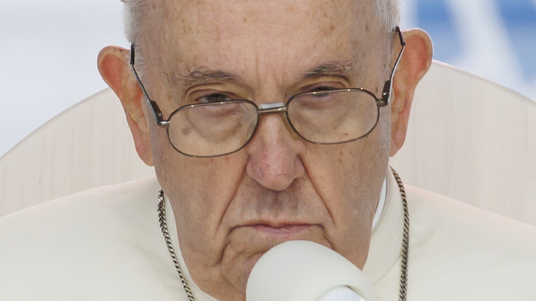 Pope Francis at a microphone