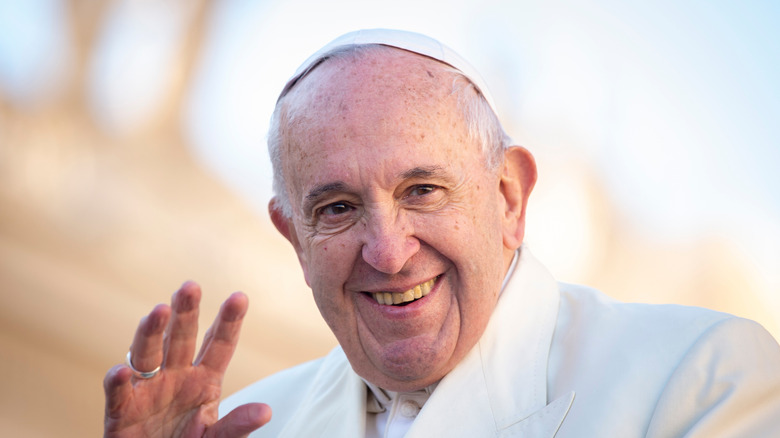 Pope Francis smiling and waving