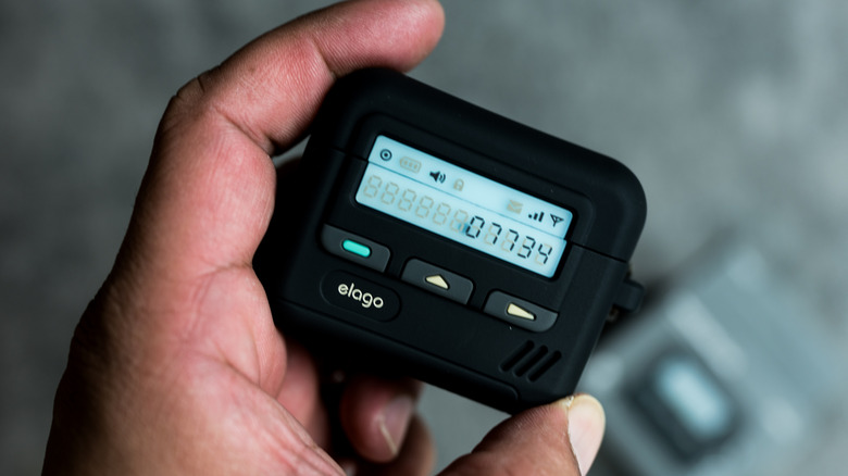 hand holding pager