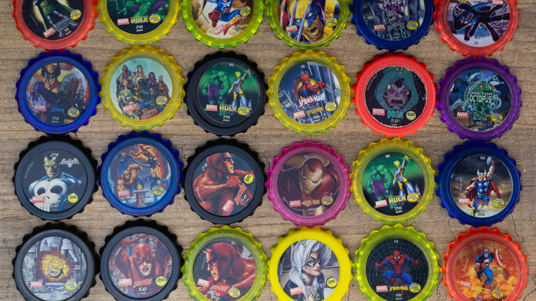 assortment of marvel comics pogs