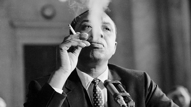 Person smoking during congressional hearing