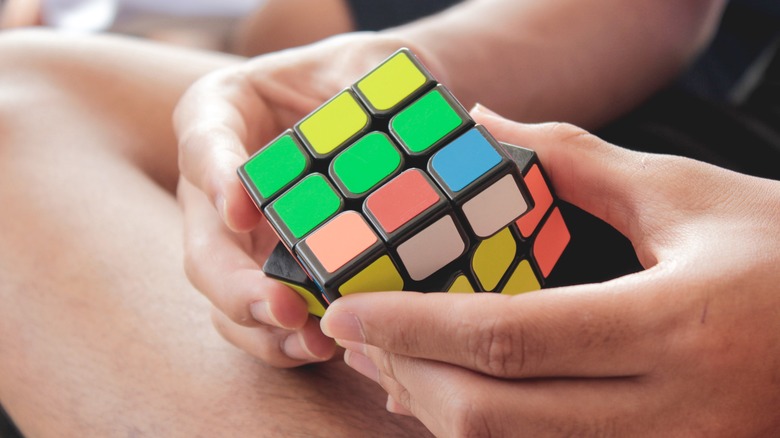 Boy solving a Rubik's Cube