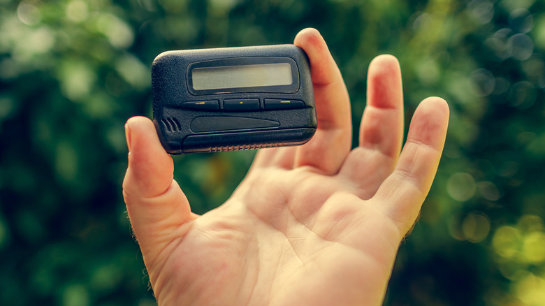 Hand holding pager