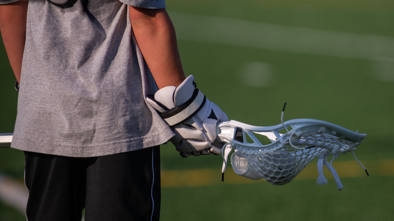 A young modern lacrosse player