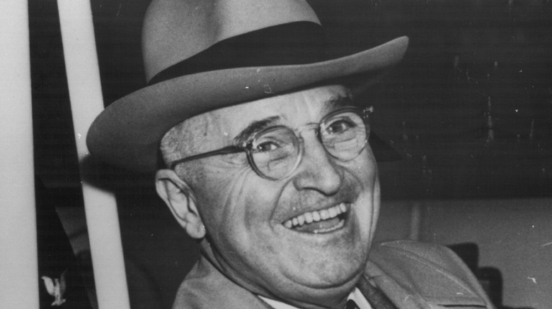 President Harry S. Truman smiling for cameras