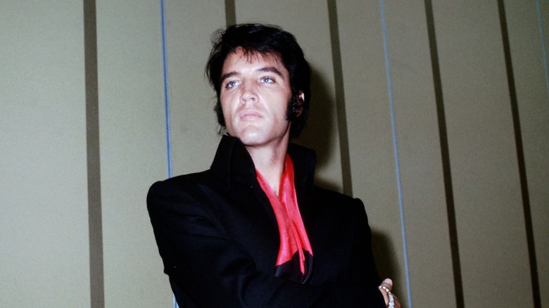 Elvis presley with arms crossed