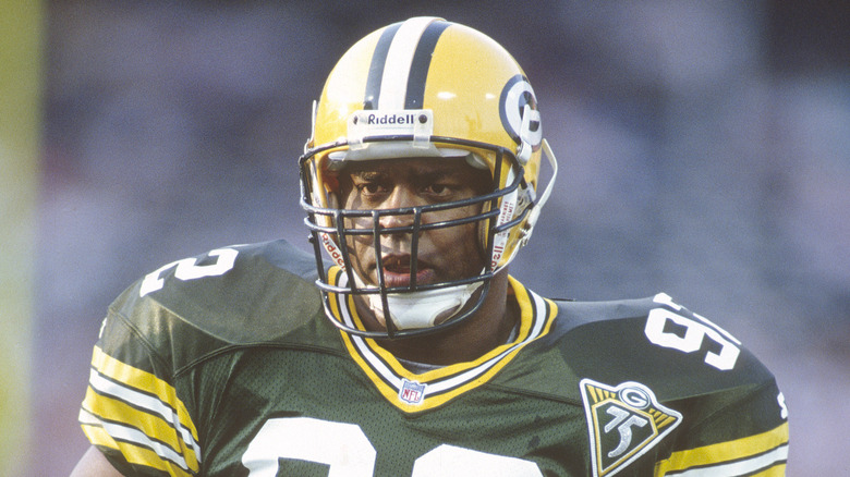 Reggie White on the field in a Packers uniform