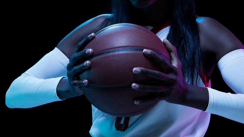 Woman holding basketball