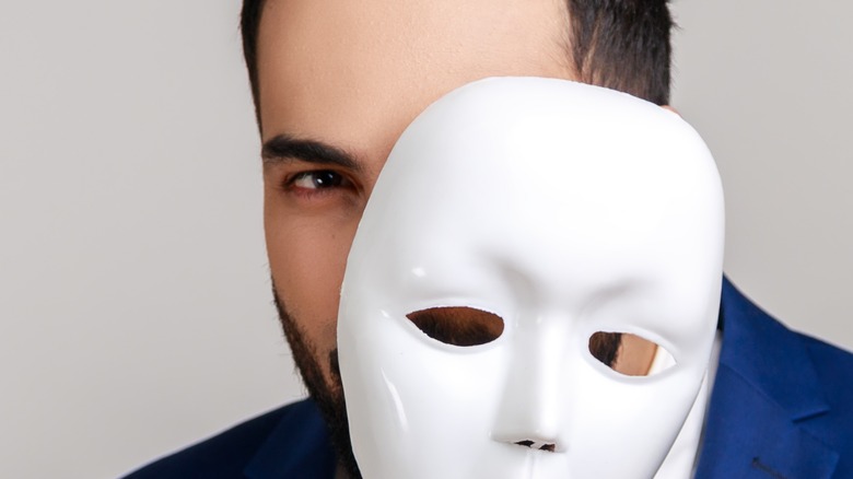 A suspicious man with a mask