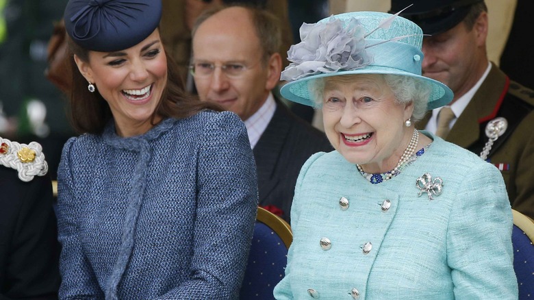 Queen Elizabeth sitting with Duchess Catherine