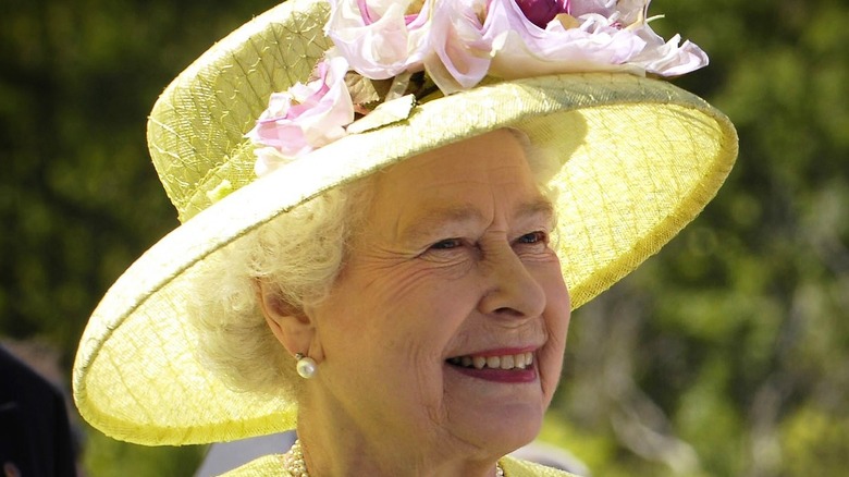 Queen Elizabeth in a yellow hat