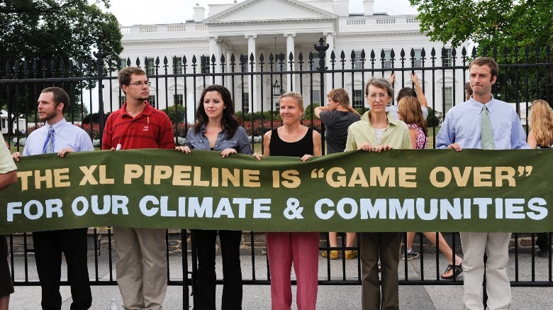Protestors holding Keystone pipeline banner