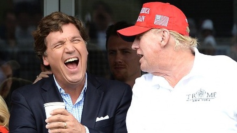 Trump laughing with Tucker Carlson