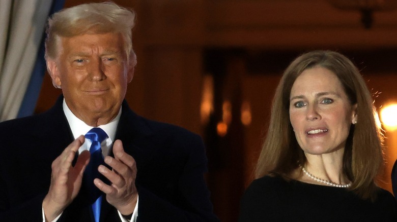 Trump and Amy Barrett standing onstage