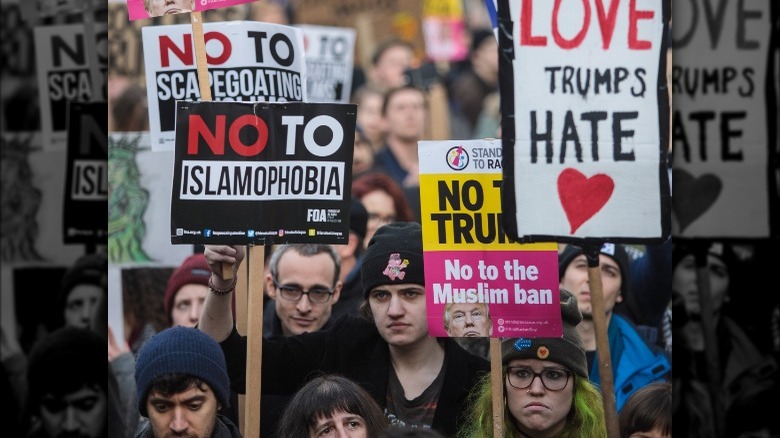 Protestors holding anti-Islamophobia signs