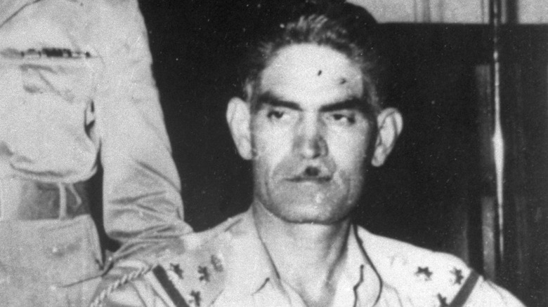 Abd al-Karim Qasim looking sternly to side