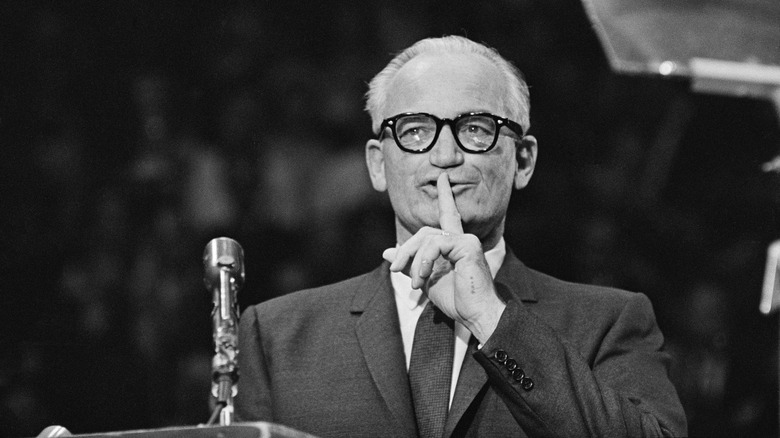 barry goldwater at podium shushing