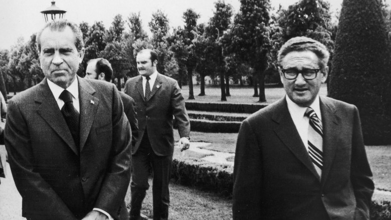 Nixon and Kissinger walking