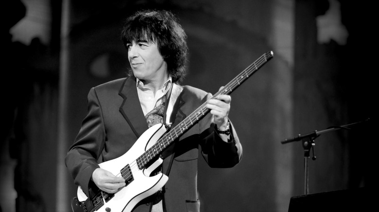 Bill Wyman playing the bass on stage