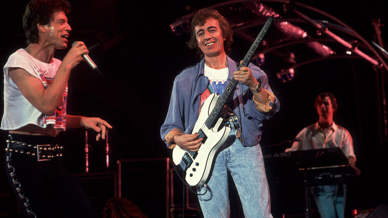 Bill Wyman playing the bass on stage with the Rolling Stones