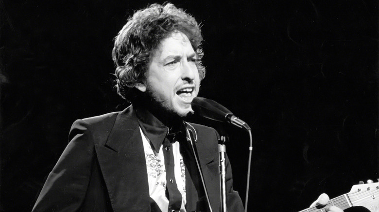 Bob Dylan singing into microphone