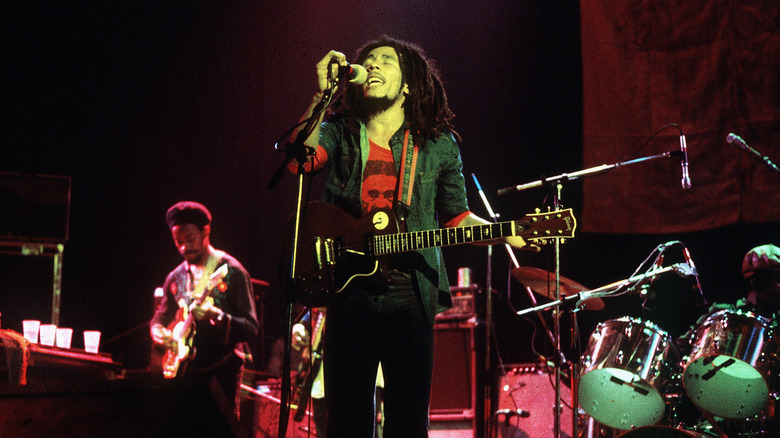 Bob Marley performing with band on stage
