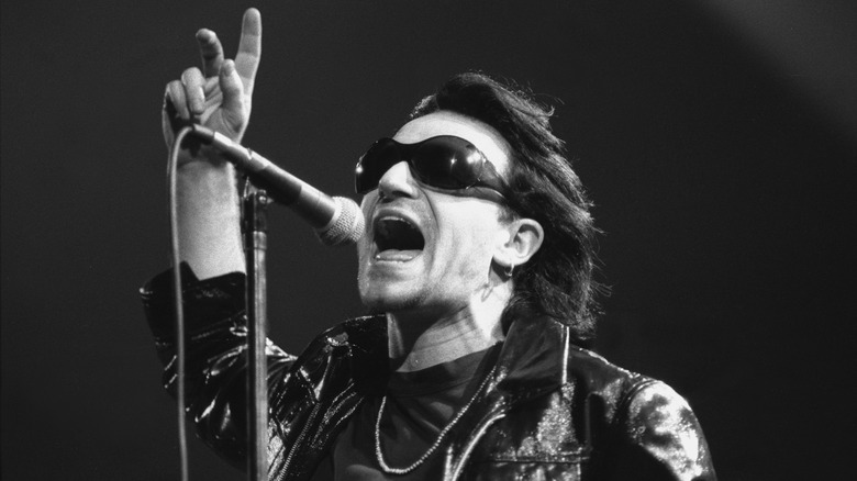 Bono singing into mic