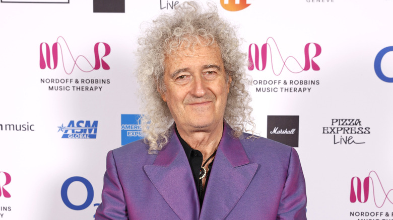 Brian May smiling