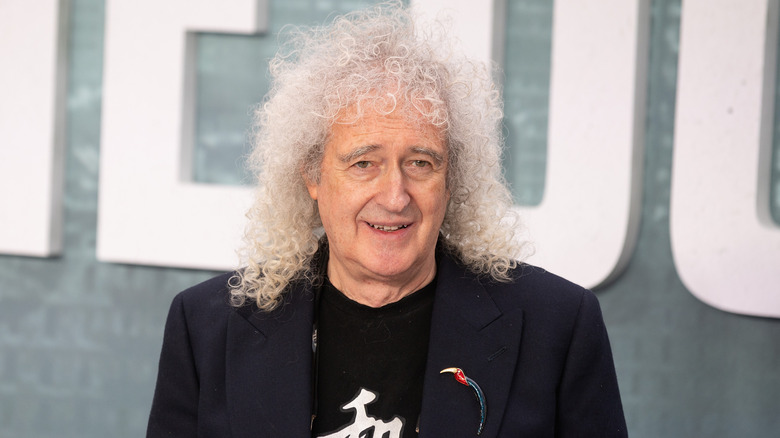 Brian May posing for a photo