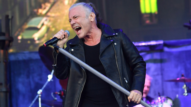 Bruce Dickinson singing into mic