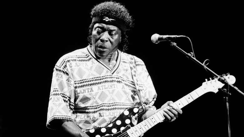 Buddy Guy playing guitar on stage