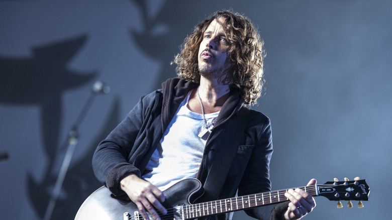 Chris Cornell playing guitar onstage in 2012