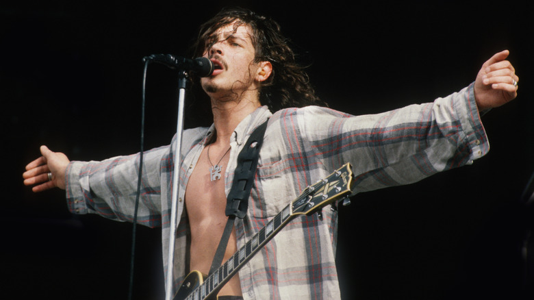 Chris Cornell opening arms on stage