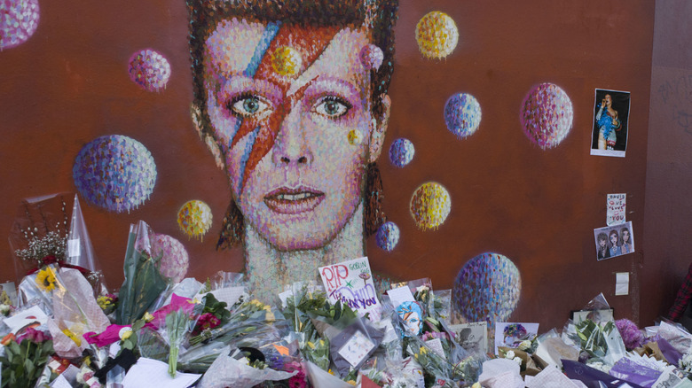 flowers and tributes left to David Bowie following his death from cancer in 2016