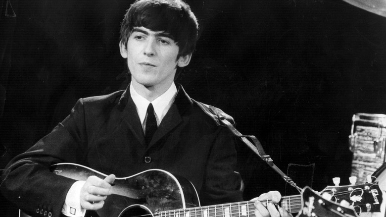 George Harrison performing during 1963 concert