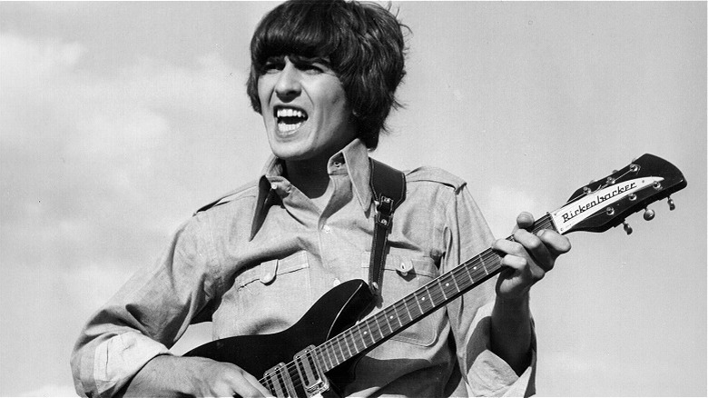 George Harrison playing guitar