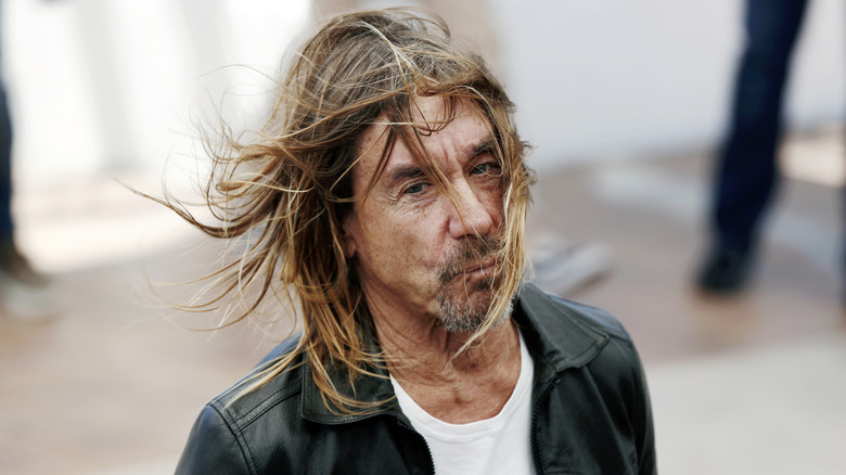 Iggy Pop in leather jacket hair blowing in wind